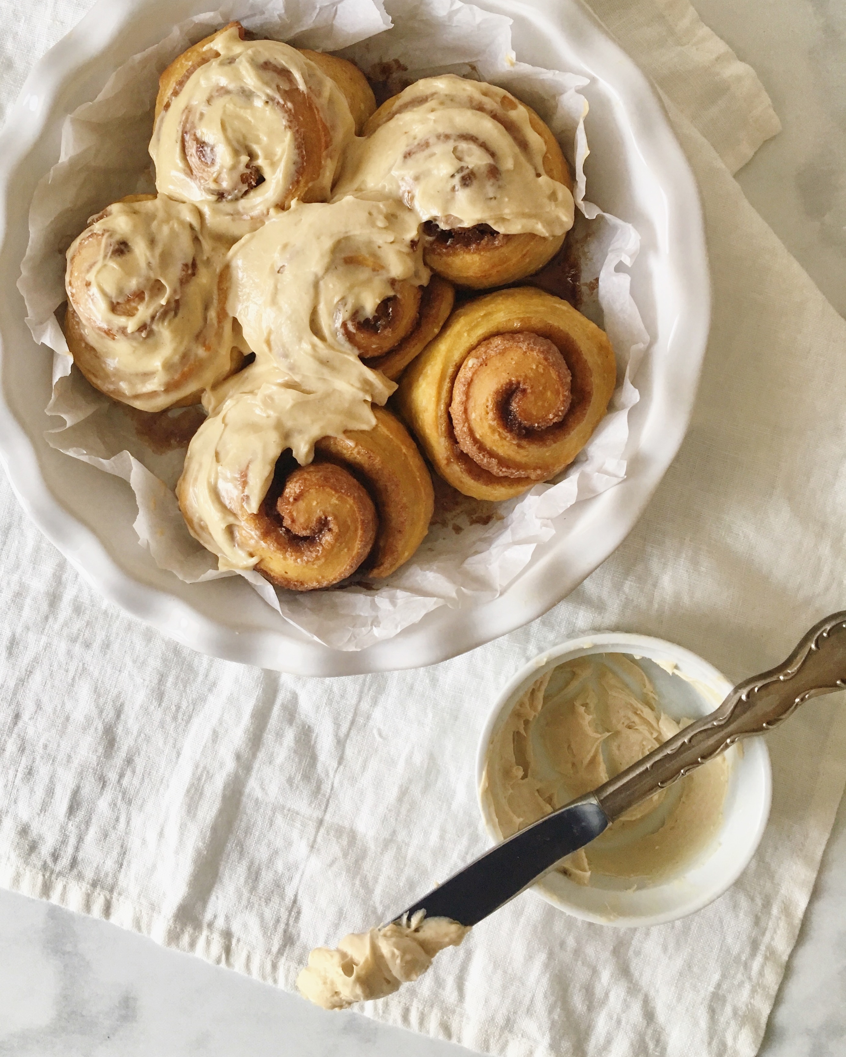 “Carrot Cake” Cinnamon Rolls with Maple-Tahini Cream Cheese Icing